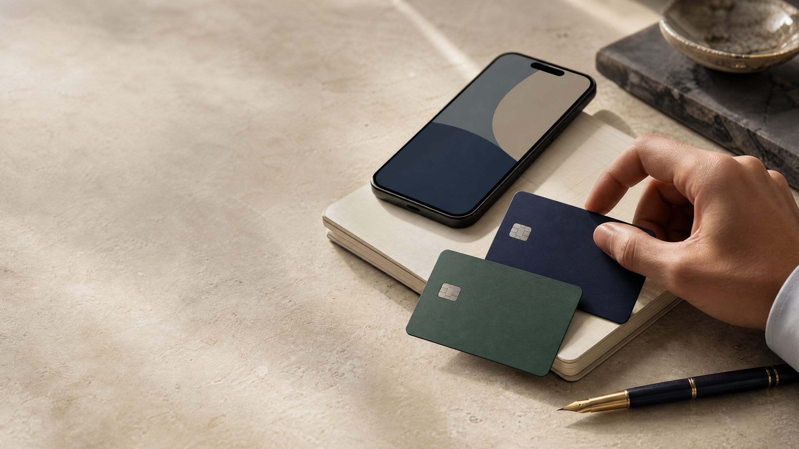 Unbranded payment cards on a ledger notebook